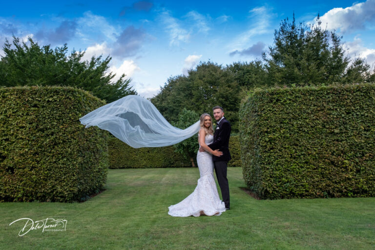 Bride and groom in the walled gardens of Saltmarshe Hall.