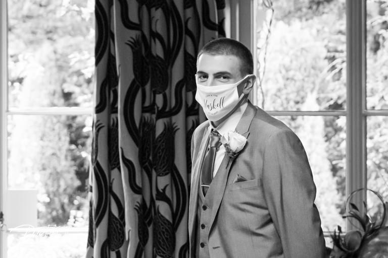 Groom on wedding day wearing a Covid face mask at The York Pavilion.