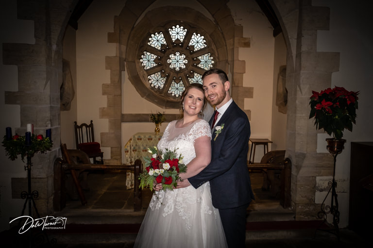 Bride and groom in St. Stevens church in Aldwark.