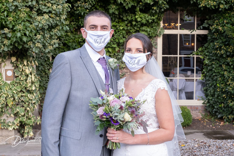 Bride and groom wearing Covid face masks at The York Pavilion.