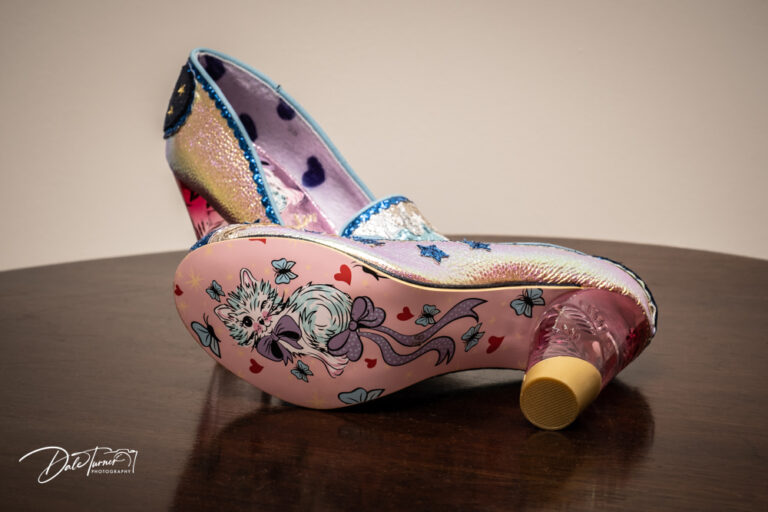 Designer wedding shoes with a cartoon cat on the soles.