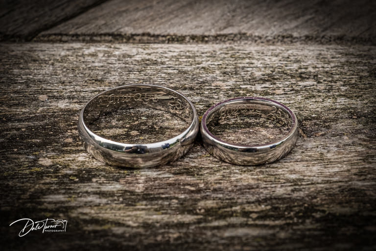 Close up of engraved wedding rings.
