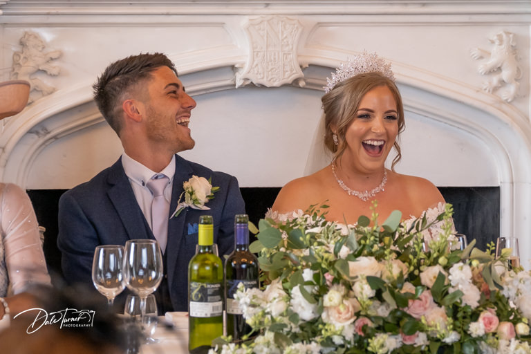 Bride and groom laughing during the wedding reception, at Allerton Castle.