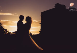 Award winning photograph of a bride and groom in silhouette with a sunset in the grounds of Carlton Towers.