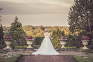 Bride from behind, looking at the scenery at Wortley Hall, Barnsley.