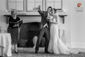 Award winning photograph of a bride and groom taking a selfie after the wedding ceremony at The Tickton Grange.
