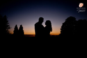 Award winning photograph of a bride and groom in silhouette with sunset in the grounds of Hooton Pagnell Hall.