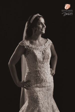 Award winning photograph of a bride with her hands on her hips and smiling, at The Principal, York.