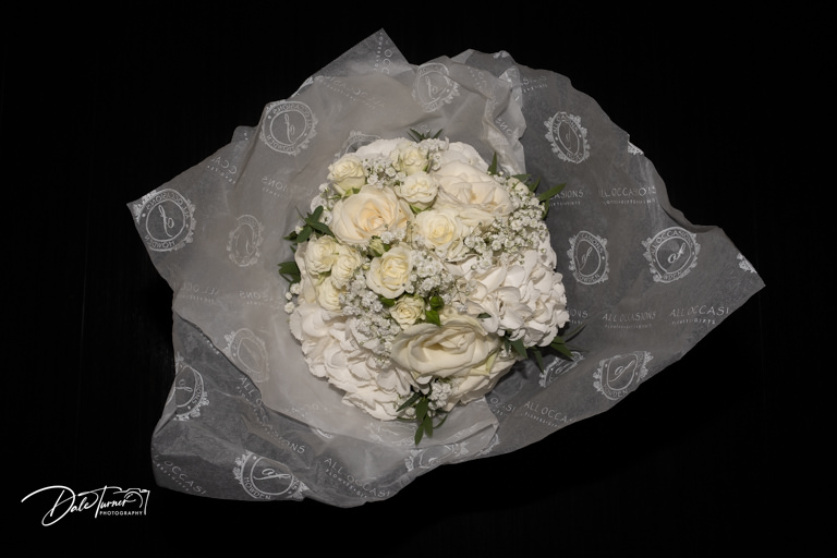 Elegant white bridal bouquet with roses.