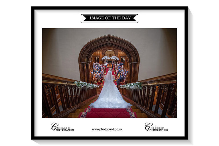 Bride walking down stairs at Allerton Castle wedding.