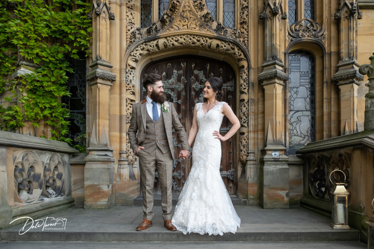 Bride and groom posing by ornate Carlton Towers entrance.