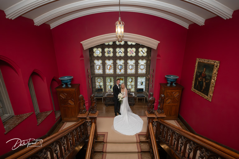 Couple wedding portrait in grand historic interior at Carlton Towers.