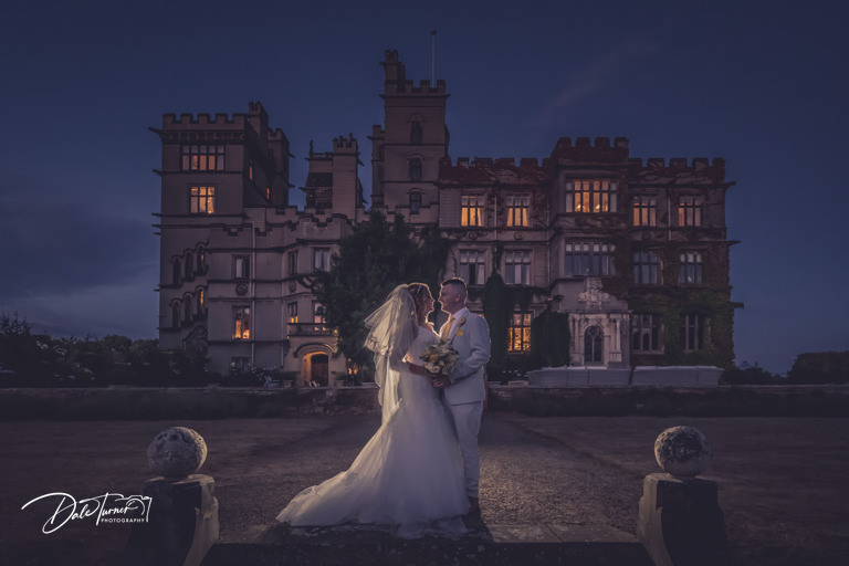 Couple wedding photo at dusk, Carlton Towers is in the background.